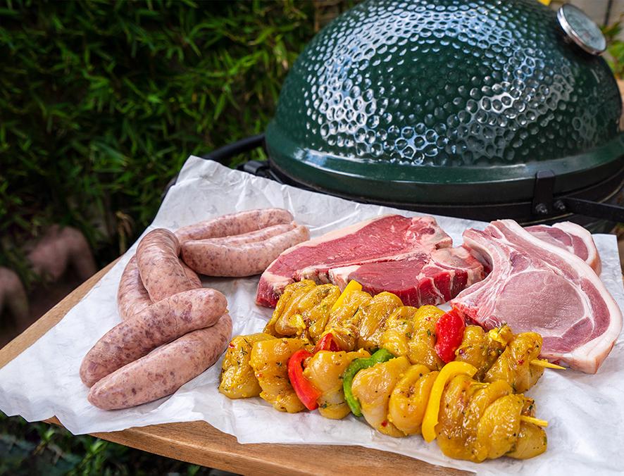 meat in front of bbq on tray