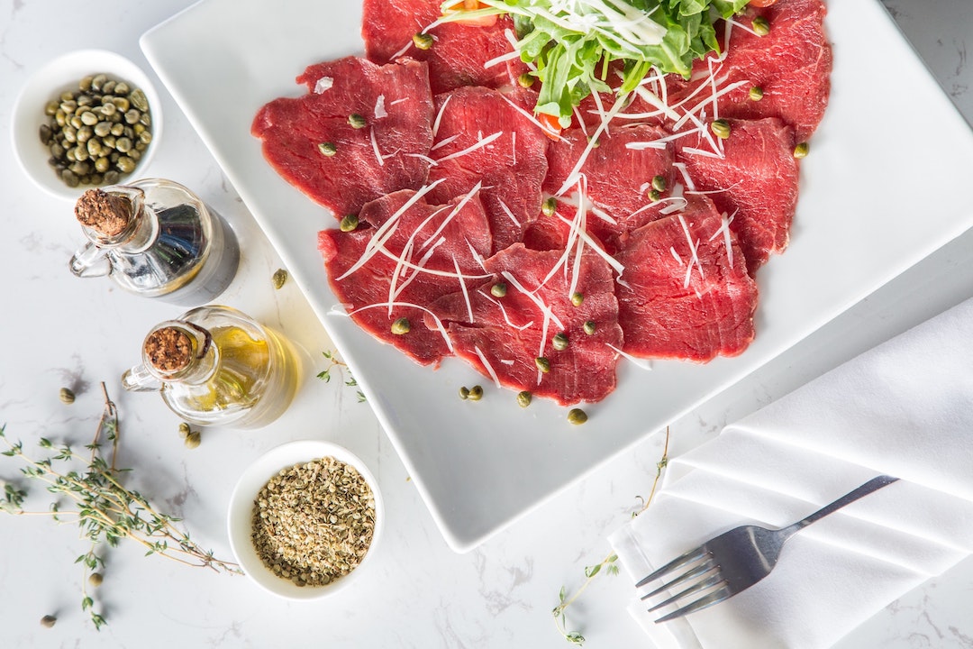 Warring man eats raw lamb